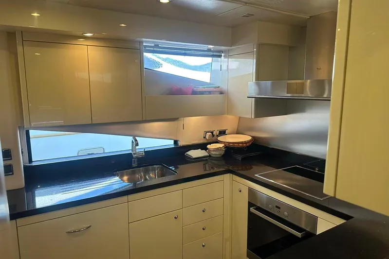  Yacht Photos Pics Luxurious kitchen interior of 2011 Sunseeker 88 Yacht with modern appliances and sleek design.