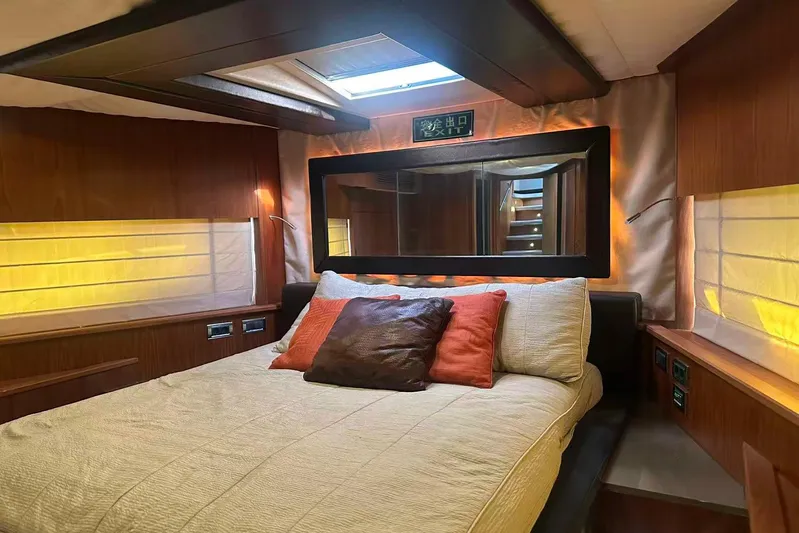  Yacht Photos Pics Luxurious bedroom interior of 2011 Sunseeker 88 Yacht with elegant lighting and decor.