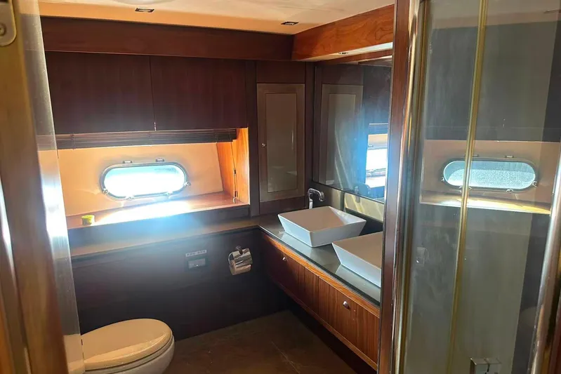  Yacht Photos Pics Luxurious bathroom in 2011 Sunseeker 88 Yacht with dual sinks and porthole window.