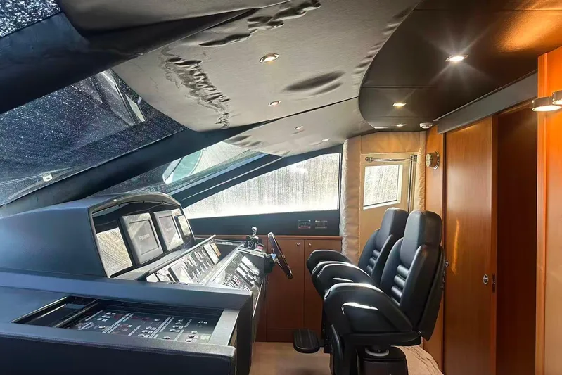  Yacht Photos Pics Luxurious interior of a 2011 Sunseeker 88 Yacht cockpit with modern controls and seating.