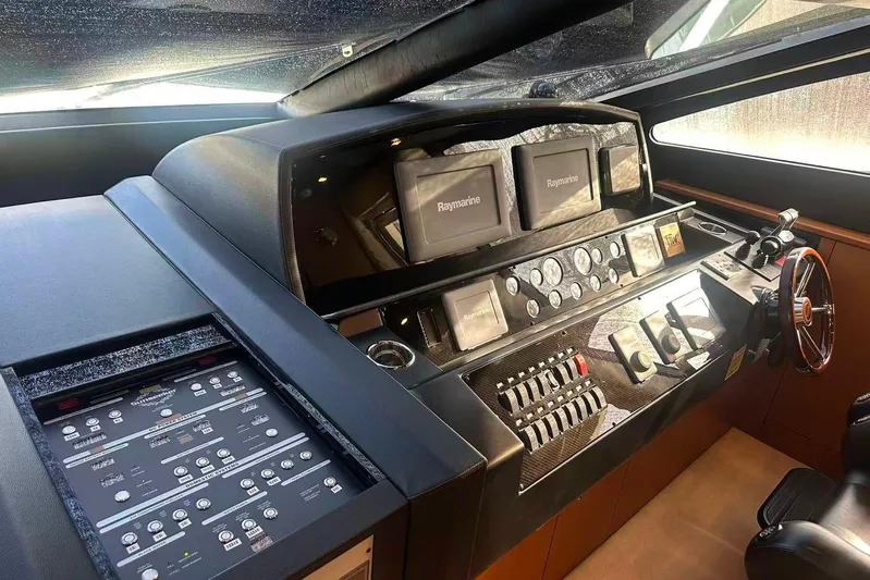  Yacht Photos Pics Cockpit of 2011 Sunseeker 88 Yacht with advanced navigation controls and Raymarine displays.