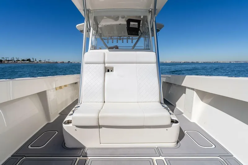 Susan L Yacht Photos Pics 2018 SeaVee 370 Z boat interior with white seating, ocean view, and clear blue sky.
