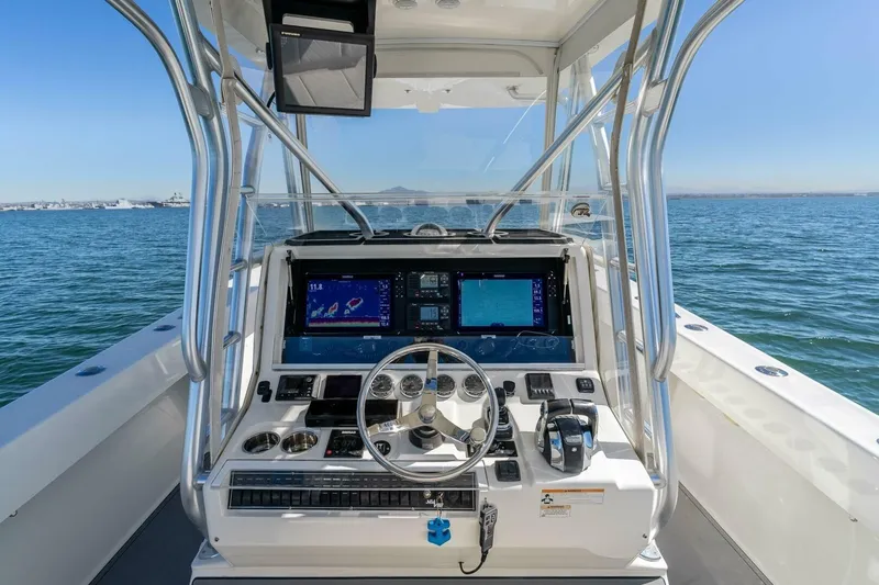 Susan L Yacht Photos Pics 2018 SeaVee 370 Z boat dashboard with navigation screens on open water.