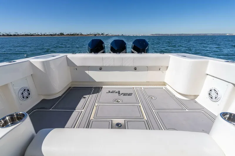 Susan L Yacht Photos Pics 2018 SeaVee 370 Z boat deck with triple outboard motors on open water.