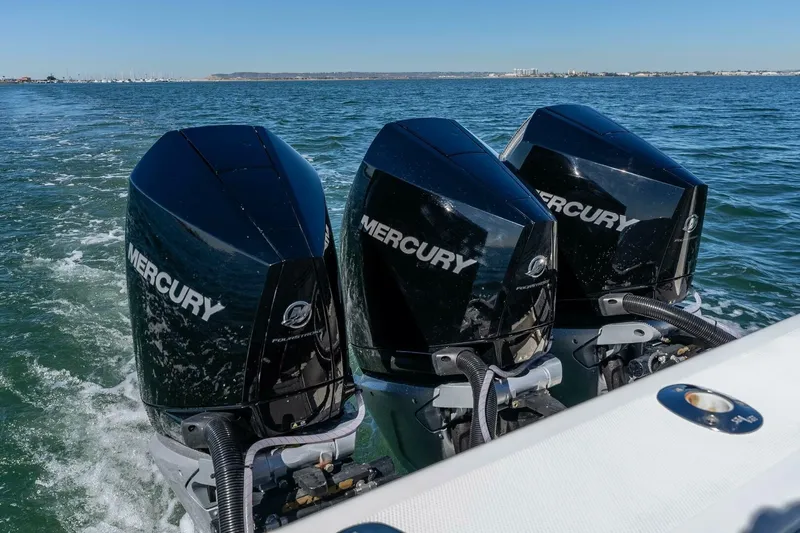 Susan L Yacht Photos Pics Triple Mercury outboard engines on a 2018 SeaVee 370 Z boat in open water.
