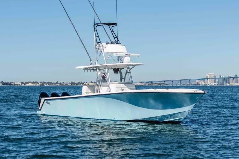 Susan L Yacht Photos Pics 2018 SeaVee 370 Z boat on water with city skyline in background.