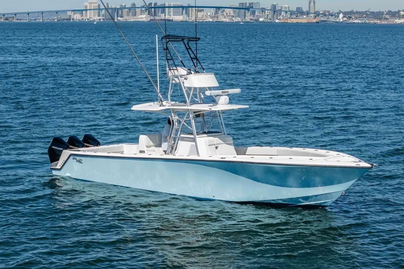 Susan L Yacht Photos Pics 2018 SeaVee 370 Z boat on open water with city skyline in background.