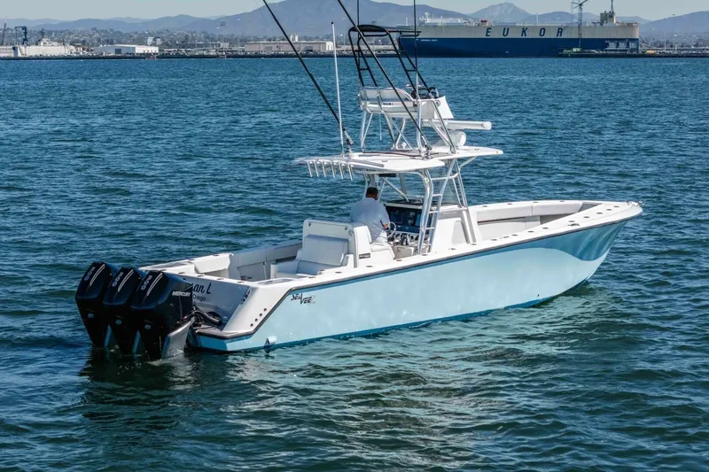 Susan L Yacht Photos Pics 2018 SeaVee 370 Z boat with triple outboard engines on calm water.