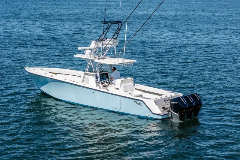 Susan L Yacht Photos Pics 2018 SeaVee 370 Z boat on calm blue water, featuring triple outboard engines.