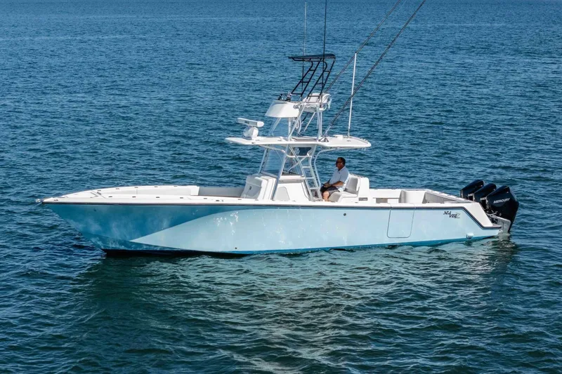 Susan L Yacht Photos Pics 2018 SeaVee 370 Z boat on calm blue water, featuring a sleek design and powerful engines.