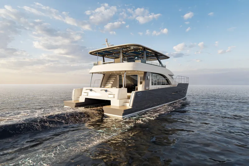 Hs 65 Yacht Photos Pics 2025 Catamaran HS 65 cruising on open water under a clear sky.