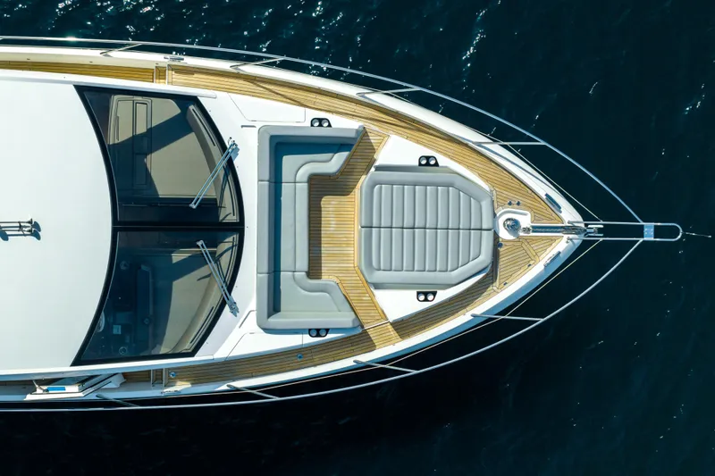 Mahalo Yacht Photos Pics Overhead view of 2018 Sunseeker Manhattan 66 yacht's deck on water.