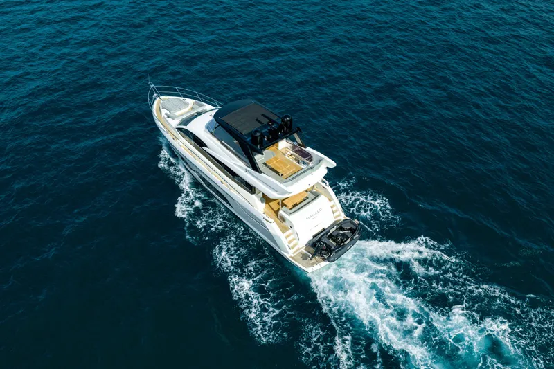 Mahalo Yacht Photos Pics 2018 Sunseeker Manhattan 66 yacht cruising on open blue sea.