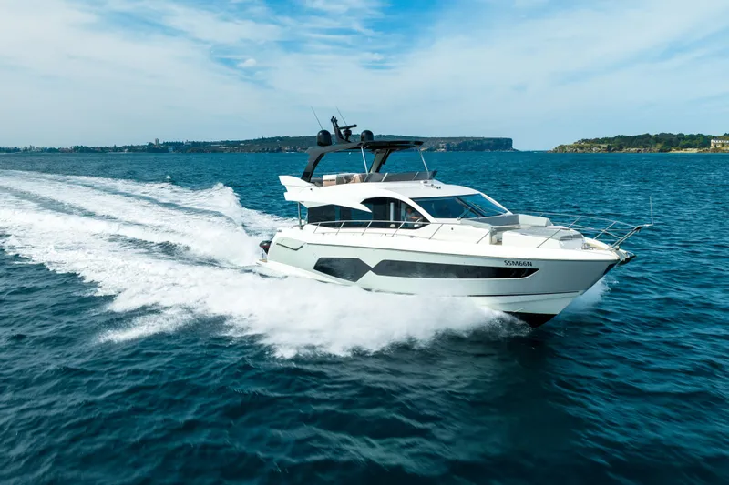 Mahalo Yacht Photos Pics 2018 Sunseeker Manhattan 66 yacht cruising on open water.