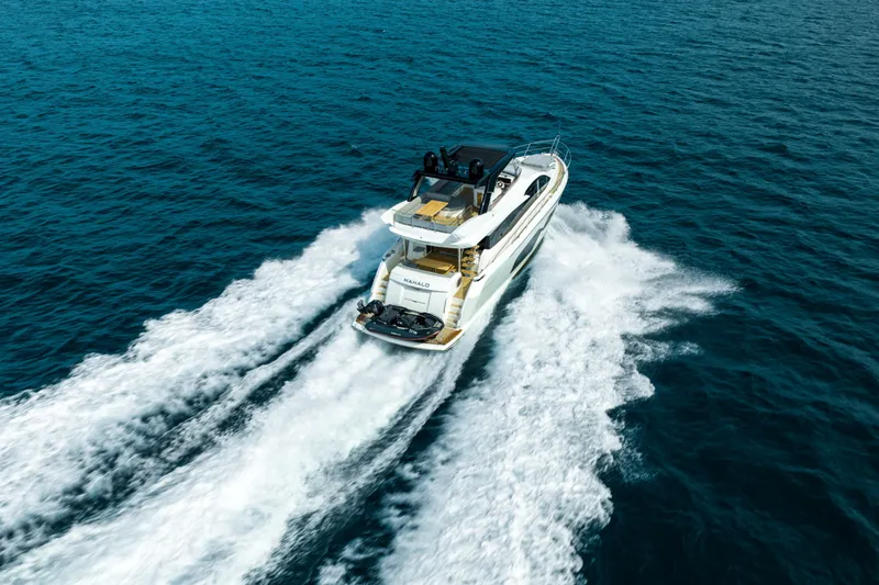 Mahalo Yacht Photos Pics 2018 Sunseeker Manhattan 66 yacht cruising on open sea, aerial view.