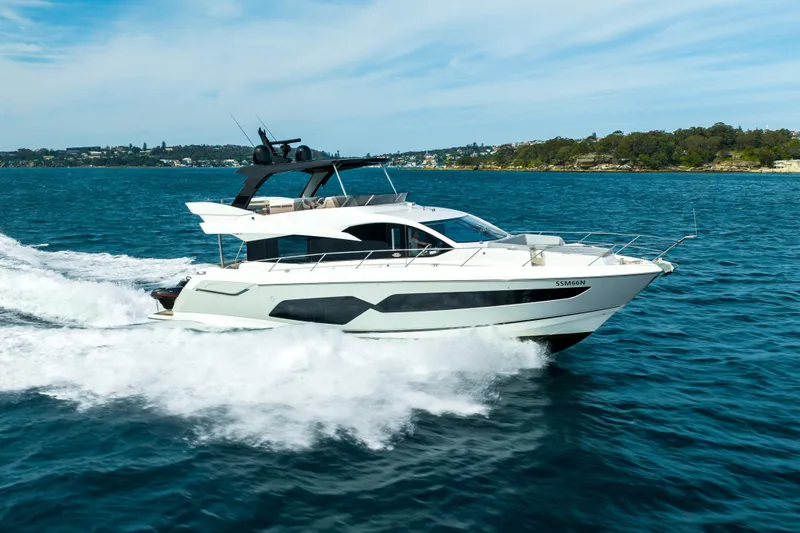 Mahalo Yacht Photos Pics 2018 Sunseeker Manhattan 66 yacht cruising on open water.