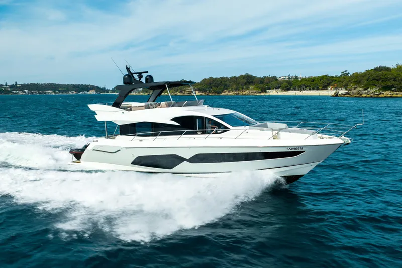 Mahalo Yacht Photos Pics 2018 Sunseeker Manhattan 66 yacht cruising on blue ocean waters.