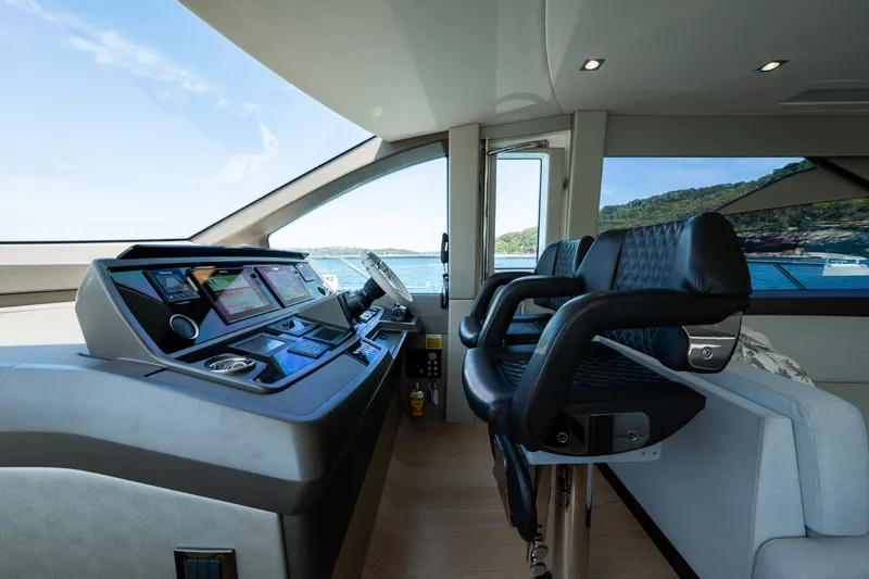 Mahalo Yacht Photos Pics 2018 Sunseeker Manhattan 66 yacht interior with modern helm and luxurious seating.