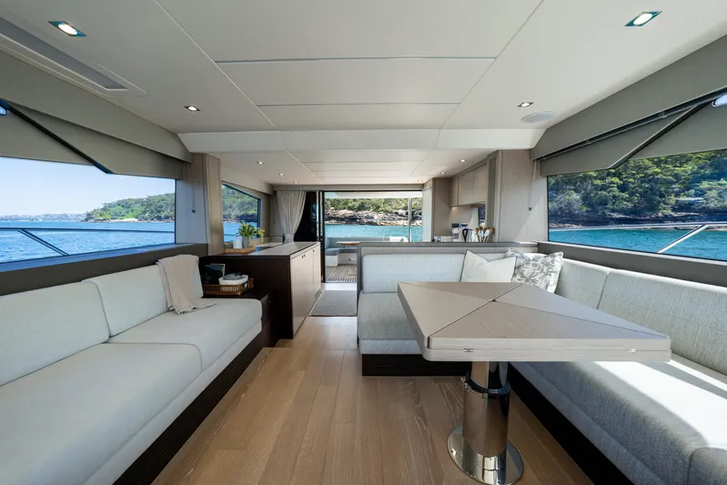 Mahalo Yacht Photos Pics Luxurious interior of 2018 Sunseeker Manhattan 66 yacht with elegant seating and scenic views.