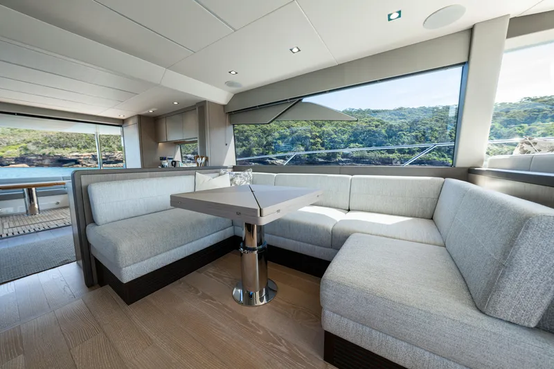 Mahalo Yacht Photos Pics Luxurious interior of 2018 Sunseeker Manhattan 66 yacht with scenic ocean view.