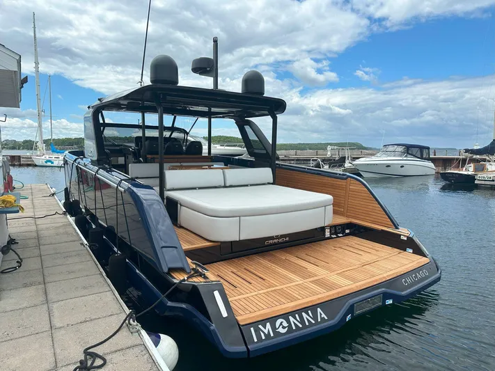 Imonna Yacht Photos Pics 2024 Cranchi A46 yacht docked, featuring sleek design and spacious deck in a marina setting.