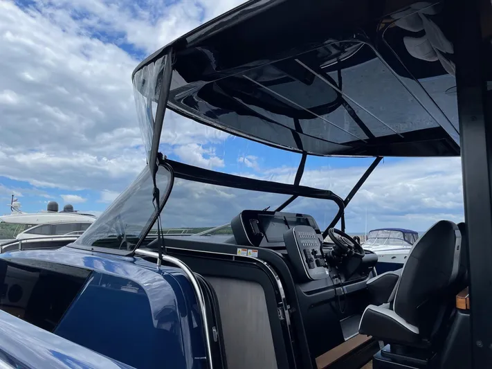 Imonna Yacht Photos Pics 2024 Cranchi A46 yacht cockpit with modern controls under a clear sky.
