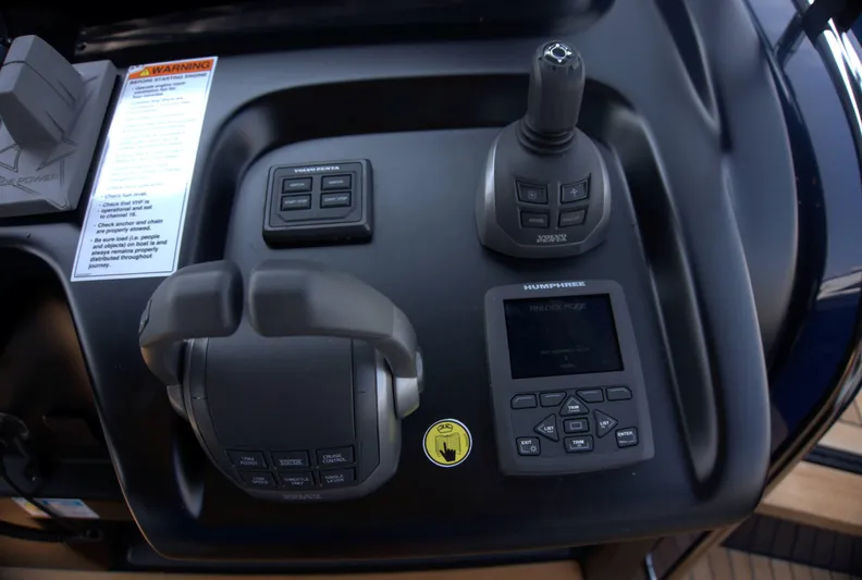 Imonna Yacht Photos Pics Control panel of 2024 Cranchi A46 yacht with joystick and display.