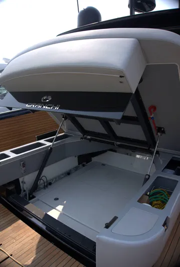 Imonna Yacht Photos Pics 2024 Cranchi A46 yacht with open storage compartment, showcasing sleek design and functionality.