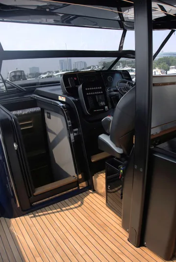 Imonna Yacht Photos Pics Interior view of 2024 Cranchi A46 yacht cockpit with modern controls and seating.