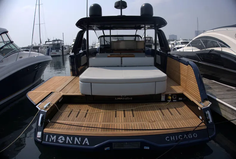 Imonna Yacht Photos Pics 2024 Cranchi A46 yacht docked in Chicago marina, featuring spacious deck and modern design.