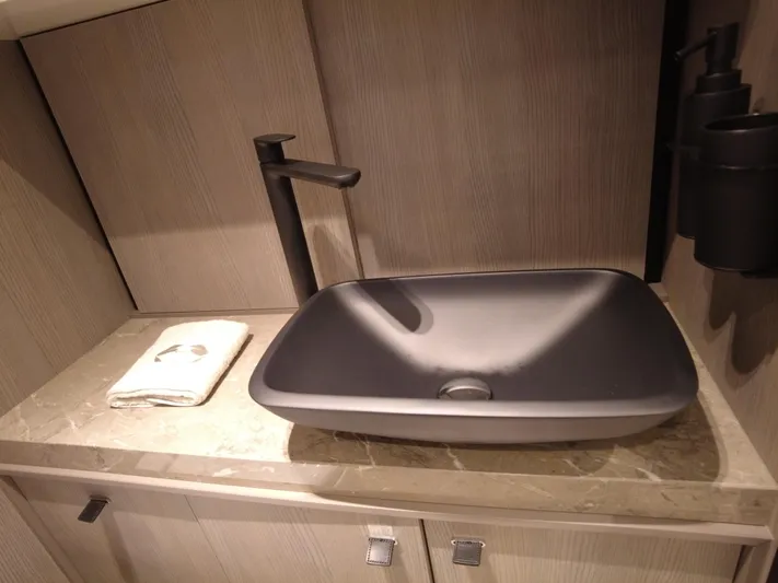 Imonna Yacht Photos Pics Modern bathroom sink in 2024 Cranchi A46 yacht, featuring sleek design and elegant fixtures.