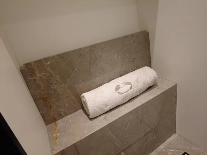 Imonna Yacht Photos Pics Luxurious marble interior of 2024 Cranchi A46 yacht with rolled towel.