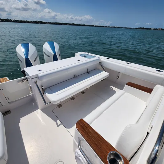  Yacht Photos Pics 2022 Southport 30 FE boat with dual engines, spacious seating, and ocean view.
