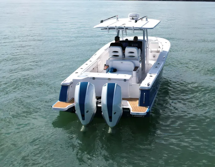  Yacht Photos Pics 2022 Southport 30 FE boat with dual engines cruising on calm water.