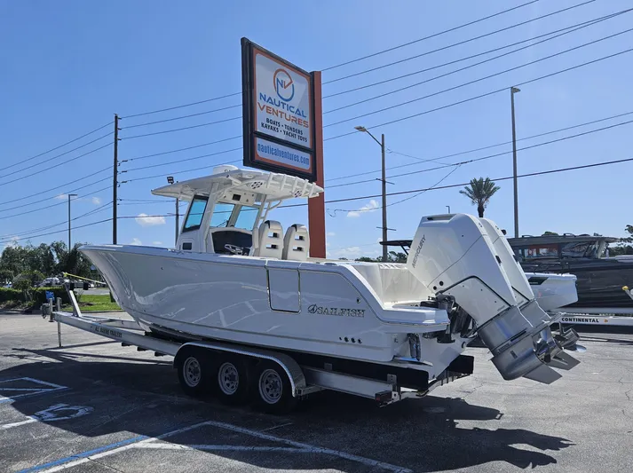  Yacht Photos Pics 2024 Sailfish 312CC boat on a trailer at a dealership.