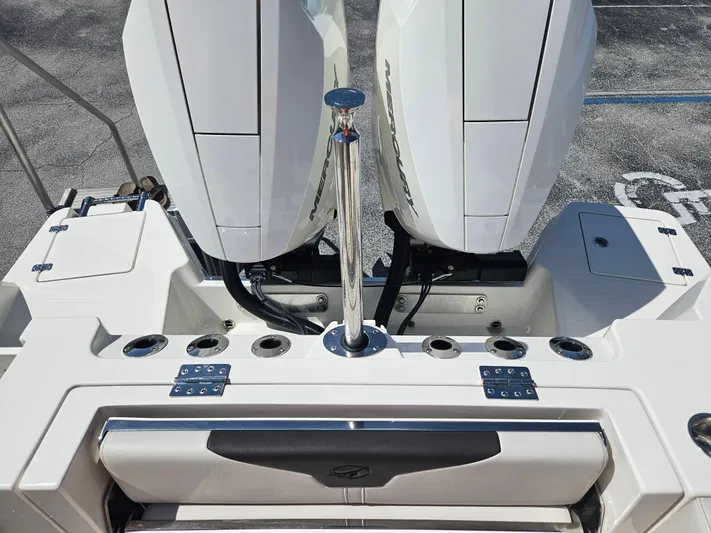  Yacht Photos Pics 2024 Sailfish 312CC boat with dual outboard engines and fishing rod holders.