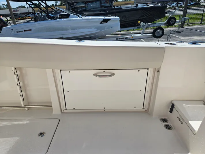  Yacht Photos Pics 2024 Sailfish 312CC boat interior with storage compartment.