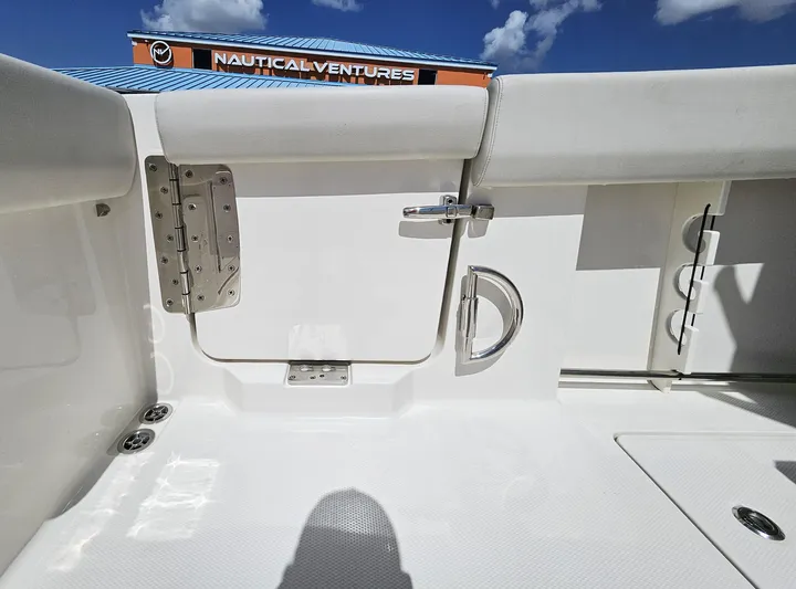  Yacht Photos Pics 2024 Sailfish 312CC boat interior with white seating and stainless steel hardware.