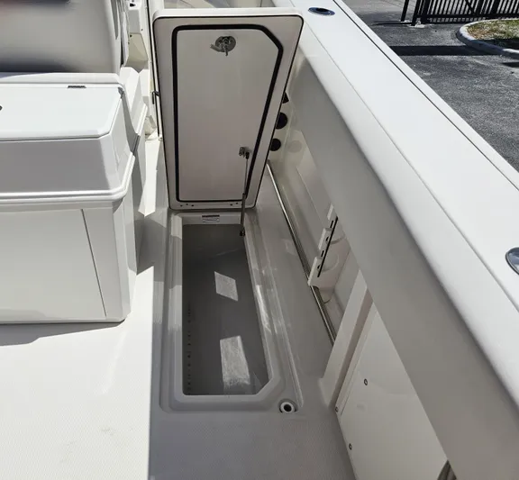  Yacht Photos Pics 2024 Sailfish 312CC boat storage compartment with open hatch.