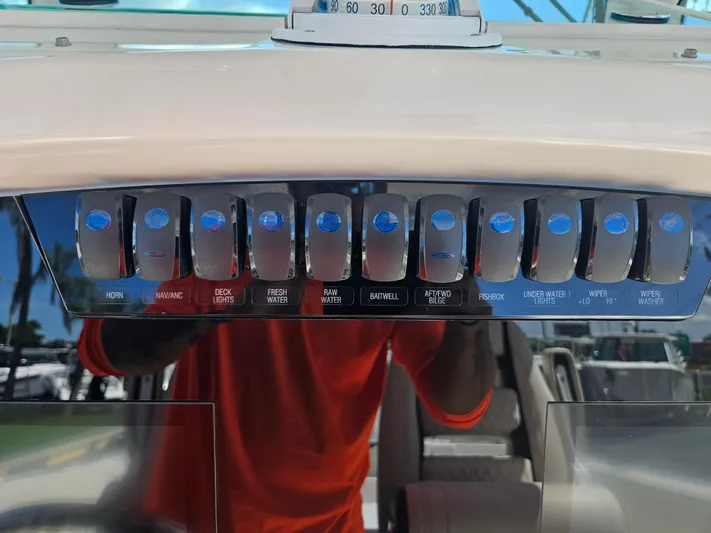  Yacht Photos Pics Control panel of a 2024 Sailfish 312CC boat with various switches.