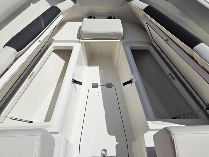  Yacht Photos Pics 2024 Sailfish 312CC boat interior with storage compartments and seating.