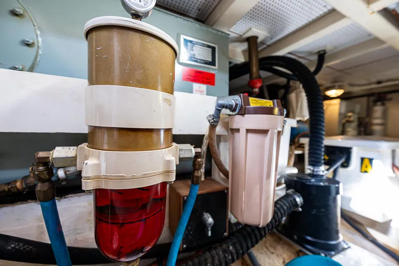 Vesper Yacht Photos Pics Engine room of a 1990 Grand Banks Sedan boat showing fuel filters and hoses.