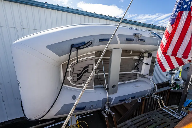 Vesper Yacht Photos Pics Inflatable boat on a 1990 Grand Banks Sedan yacht with American flag.