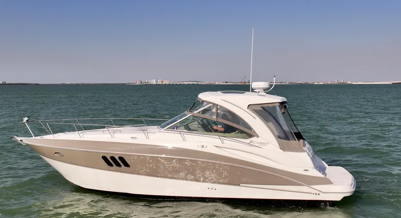 Tarpon III Yacht Photos Pics 2009 Cruisers Yachts 360 Express on open water, side view.