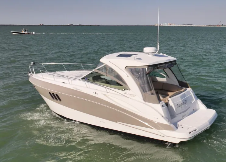 Tarpon III Yacht Photos Pics 2009 Cruisers Yachts 360 Express on open water, showcasing sleek design and luxury features.