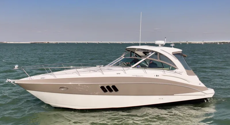 Tarpon III Yacht Photos Pics 2009 Cruisers Yachts 360 Express on calm water, showcasing sleek design and modern features.