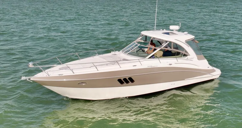 Tarpon III Yacht Photos Pics 2009 Cruisers Yachts 360 Express on calm water, showcasing sleek design and luxury features.