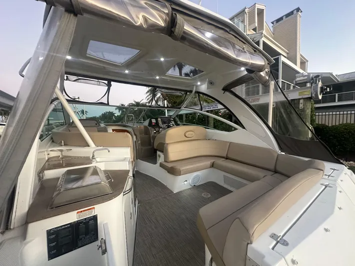 Tarpon III Yacht Photos Pics 2009 Cruisers Yachts 360 Express interior with beige seating and modern design.