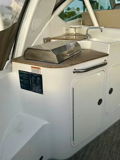 Tarpon III Yacht Photos Pics 2009 Cruisers Yachts 360 Express boat interior with kitchenette and grill.