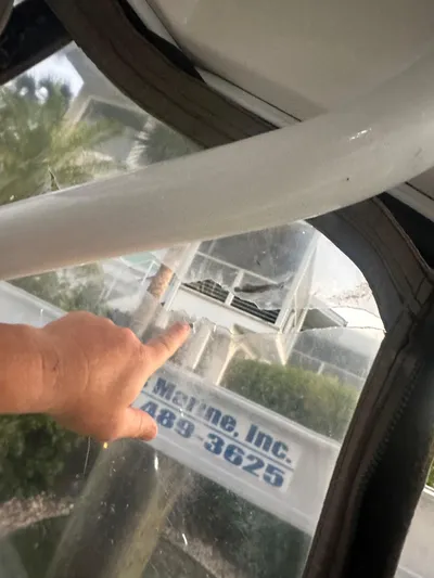 Tarpon III Yacht Photos Pics Hand pointing inside 2009 Cruisers Yachts 360 Express, with a view of a marine service sign.